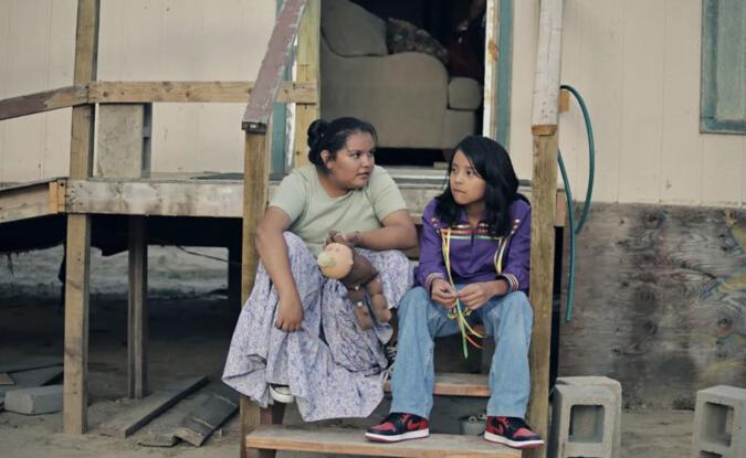 Two kids sitting on steps