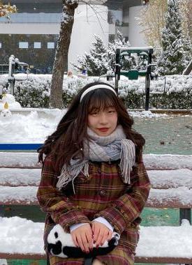 Chinese Language Resident sitting on a bench